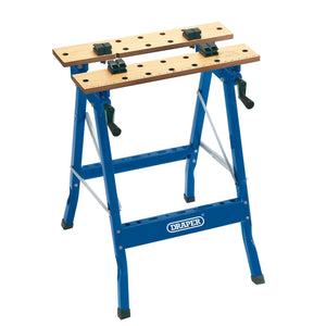 A Draper Fold Down Workbench, featuring a blue and wood design with sturdy legs, adjustable clamps, and the Draper logo on the frame. The workbench measures 600 X 640 X 785mm (model WB600Y).