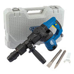 A Draper Expert 230V SDS MAX Breaker (7Kg, 1050W - PHD1050MAX) in blue and black is placed in front of its gray carrying case, accompanied by two SDS MAX chisels and a white tool.