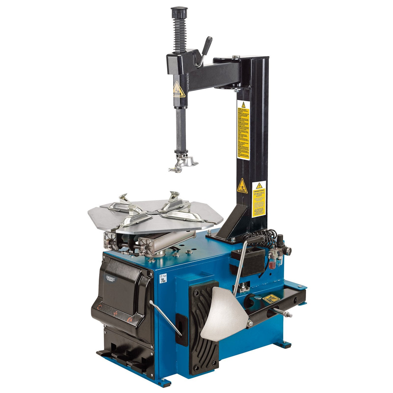 The Draper Semi Automatic Tyre Changer - TC100, by Draper, is a blue and black unit equipped with various levers, a motorised turntable, and a mounting arm. Warning labels are clearly visible on the equipment.