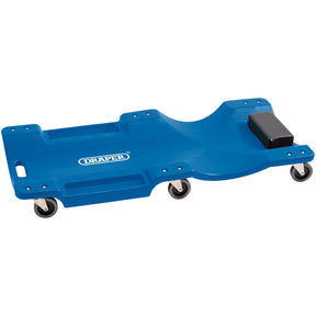 The Draper Mechanic's Creeper, Blue - CC4/B features four multi-directional castors, a molded plastic body with a foam headrest, and convenient handle cutouts. It proudly displays the "Draper" brand in white text.