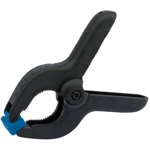 A durable Draper Spring Clamp, 36mm - NSC-3/A in black plastic with a blue tip is shown. The clamp is partially opened, revealing textured gripping surfaces on the jaws. Ideal for multiple uses, this versatile tool suits both domestic use and various projects.