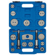 The Draper Expert Brake Caliper Piston Wind-Back Kit (18 Piece) - CWBT18B, a blue plastic storage case containing various metal automotive brake caliper piston rewind tools and adapters, organized in specific slots, is perfect for DIY mechanics working on replacement brake pads.