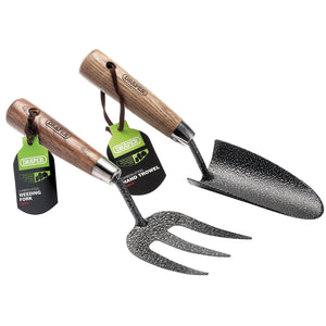 The Draper Carbon Steel Heavy Duty Hand Fork and Trowel Set (GCAFT2/I) includes two pieces with ash handles, prominently displaying the Draper brand. The set features a heavy-duty carbon steel hand fork with three prongs, ideal for weeding, and a trowel with a wide, flat blade suitable for various garden tasks.