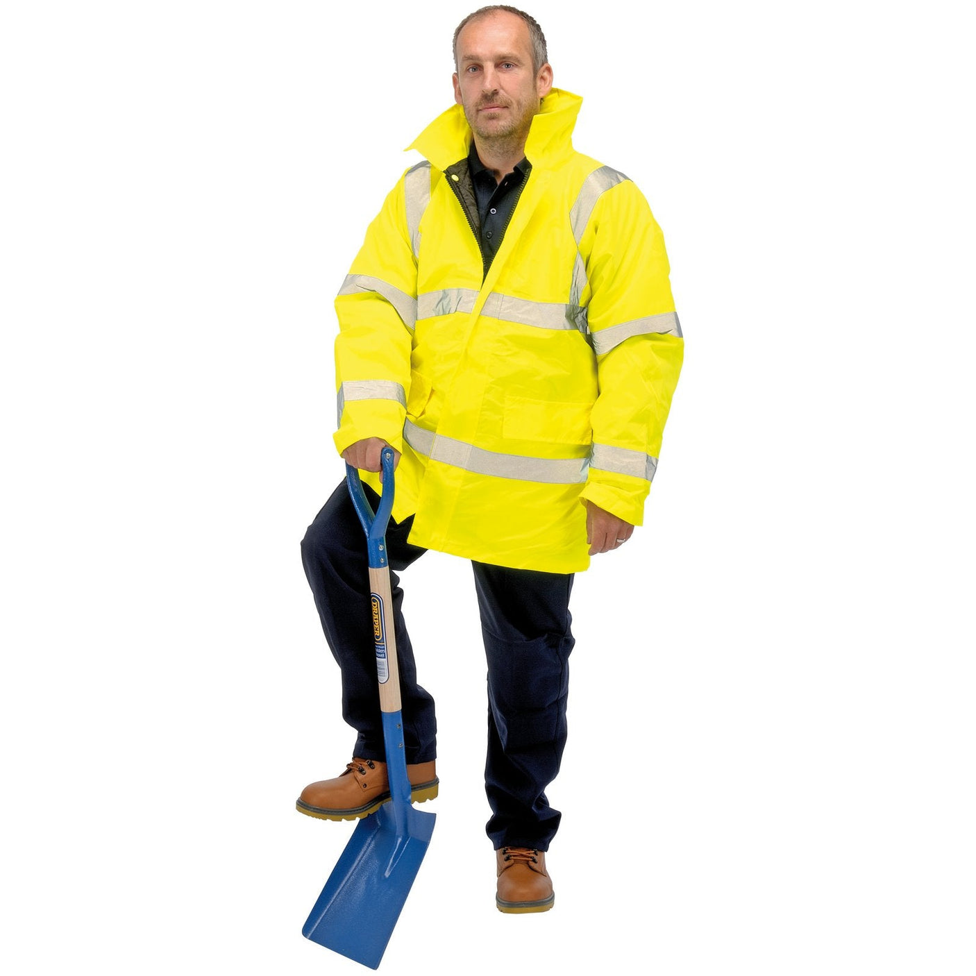 A person in a Draper High Visibility Traffic Jacket (Size M - HVTJA/B) with reflective tape and black pants stands with one foot on a blue shovel.