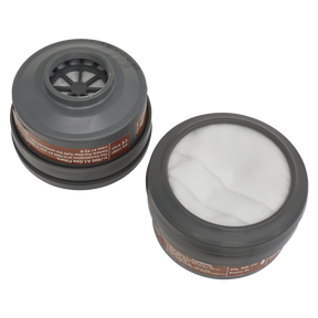 Two round, grey gas mask filters from Sealey's A1P2R Filter Cartridge - Pack of 2 - 9361. One filter reveals the internal structure, while the other displays the white fabric surface. Both feature brown labels with text around the sides, designed for organic vapour protection. Compatible with Model No. 9360 series Half Masks.