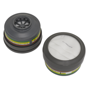 Two round air filter cartridges from Sealey, one showing the top view with a mesh center and the other displaying the bottom side covered with a white material. Both have colored labels around the sides and are part of the ABEK1 P2R Cartridge - Pack of 2 - 9363 for organic vapor protection in Model No. 9360 series Half Masks.