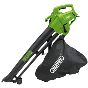 A Draper 230V Garden Vacuum, Blower and Mulcher, 3000W - BV3000/B in green and black, complete with an attached collection bag, is angled upwards. This versatile garden tool also serves as a mulcher and is equipped with front wheels for easy maneuvering.