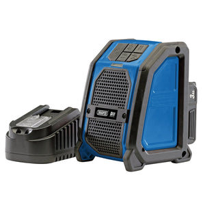 A sleek black battery pack lies beside a blue and black Draper D20 20V Portable Bluetooth Wireless Speaker, featuring the innovative D20 Multi-tool battery system.