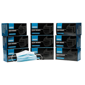 Several boxes of Draper Disposable Face Masks – Bulk Buy (Pack Of 50) - *CMFM are stacked together, with one face mask positioned in front, ready for use against non-toxic dust particles during general work.
