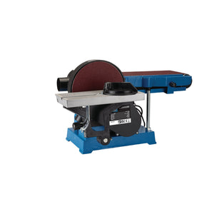 The Draper Expert 230V Belt And Disc Sander With Tool Stand, model BDS750E, features a blue base and black motor housing. It's equipped with a powerful 750W motor and comes with a 150mm sanding disc and belt, making it ideal for woodworking or metalworking tasks. Additionally, it includes a dust extraction outlet to keep your workspace clean.