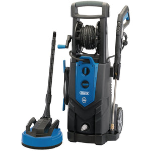 Introducing the Draper Pressure Washer, 2500W, 195Bar - PW2500I/130D, featuring a blue and black design with an induction motor. The washer is equipped with wheels, a hose reel, and an attached nozzle. Additionally, it includes a detachable brush head accessory for added versatility.