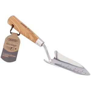 A traditional style Draper Heritage stainless steel transplanting trowel with an ash handle, featuring a cardboard tag labeled "Draper Heritage" - DGHTTG/L.