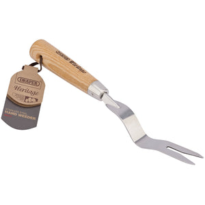 The Draper Heritage Stainless Steel Hand Weeder with an Ash Handle, model DGHWG/L, features a flat metal base with a forked tip specifically designed for removing weeds. A product tag is attached to the handle.