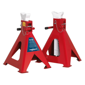 Sealey's AAS10000 Axle Stands, capable of supporting 10 tonnes each, feature a pair of red heavy-duty ratchet-type stands with cast iron support posts, triangular bases, ratcheting arms, and safety pins designed to securely support raised vehicles.