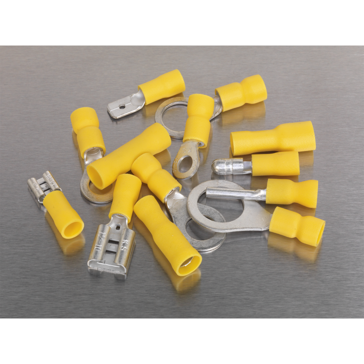 The Sealey Crimp Terminal Assortment 140pc Yellow - AB041YT is neatly arranged on a gray metallic surface.