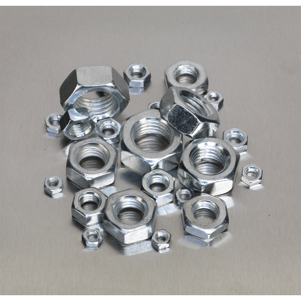 A collection of Sealey Steel Nut Assortment 255pc M4-M16 Metric - AB046SN arranged on a flat, metallic surface.