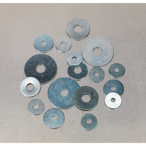 A group of variously sized metal washers, including the Sealey Repair Washer Assortment 240pc M5-M10 Metric Zinc Plated (AB059RW), arranged on a flat surface.