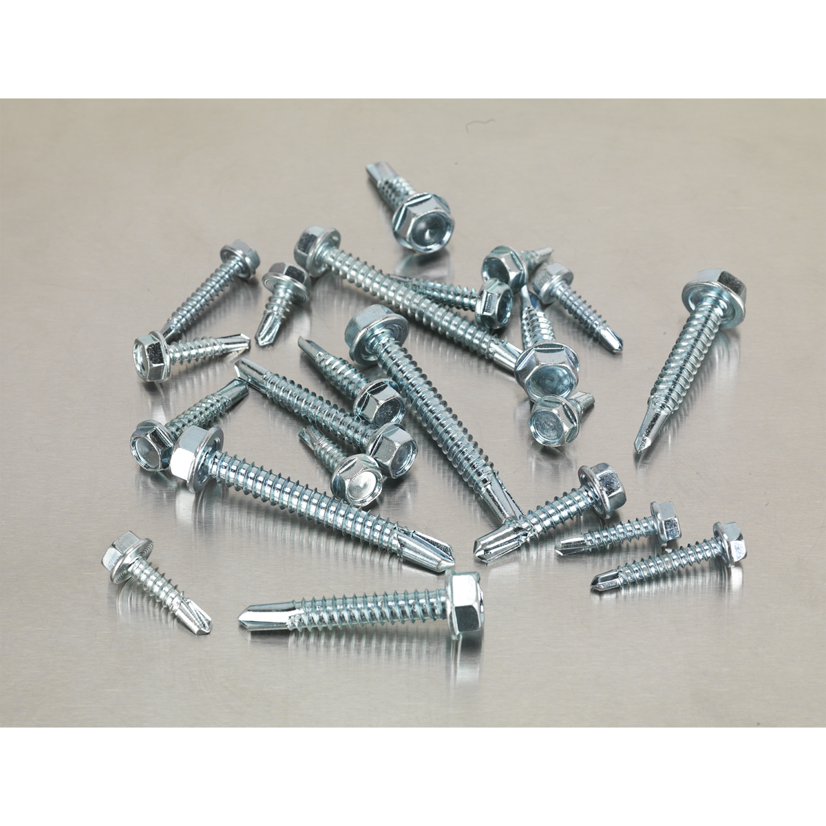 Sealey's 410-piece Self-Drilling Screw Assortment, product code AB061SDH, with hexagon heads and zinc coating, is neatly arranged on a flat, light-colored surface.