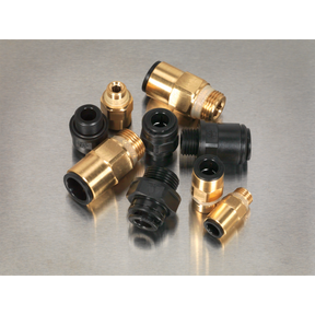 A selection of Sealey Speedfit® Thread Adaptor Assortment 30pc Metric & Imperial - AB072JG brass and black plastic pneumatic fittings, including thread adaptors and Speedfit pneumatic couplings, arranged on a metal surface.