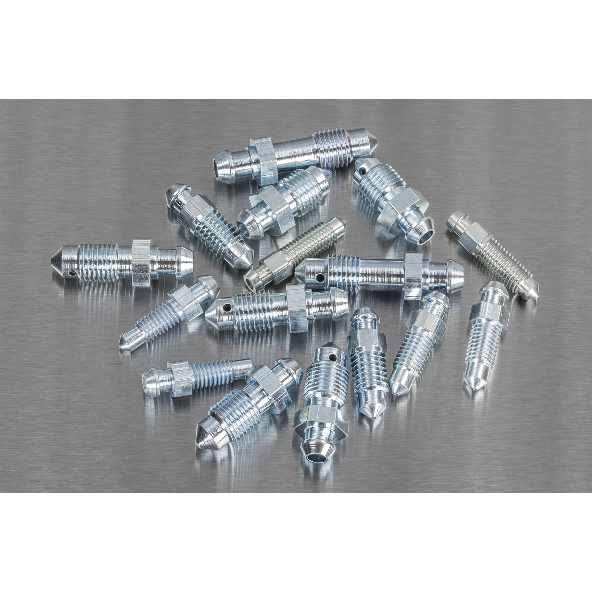 A meticulously arranged assortment of Sealey Bleed Nipple Assortment 160pc (AB160BN) metallic brake bleeder screws, featuring various sizes including metric options, displayed on a flat surface.