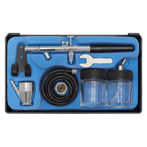 The Sealey Air Brush Kit Professional without Propellant (AB932) includes a 0.35mm nozzle, metal body, hose, wrench, and two glass jars all neatly organized in a blue foam case.