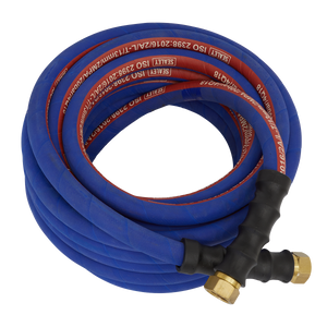 A coiled industrial hose, identified as the Sealey Air Hose 10m x Ø13mm with 1/2"BSP Unions Extra-Heavy-Duty - AH10R/12, is shown lying on a white background; it features a blue high-quality rubber build with red labels, brass fittings, and bend restrictors.