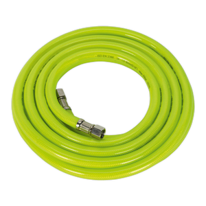 The Sealey Air Hose High-Visibility 5m x Ø8mm with 1/4"BSP Unions - AHFC5 is a coiled, bright green hose featuring a reinforced PVC outer coating and metal connectors on both ends, specifically designed for use with high-pressure water or air systems.