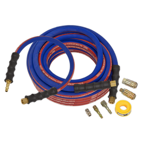 Two coiled refrigerant hoses in blue and red with brass connectors, various small attachment parts, a yellow roll of sealing tape, and the Sealey Air Hose Kit Extra-Heavy-Duty 15m x Ø10mm with Connectors (AHK02).
