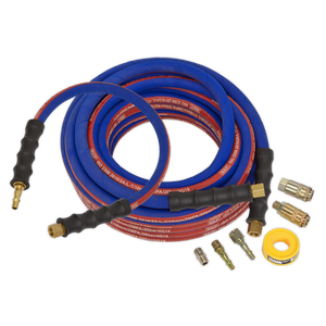 Two coiled refrigerant hoses in blue and red with brass connectors, various small attachment parts, a yellow roll of sealing tape, and the Sealey Air Hose Kit Extra-Heavy-Duty 15m x Ø10mm with Connectors (AHK02).