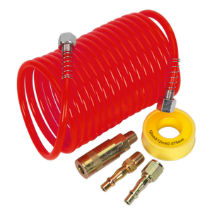 A Sealey Air Hose Kit 5m x Ø5mm PE Coiled with Connectors (AHK03) includes a coiled red rubber air hose connected to two metal fittings and a yellow tape roll labeled "12mx12mX0.07.5mm." The kit also comes with two small metal adapters and a quick release coupling for easy connections.