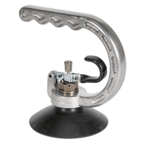 The Professional Dent Puller Ø100mm - AK101 by Sealey is a high-quality tool with a sleek silver finish, mounted on a rugged black base. It features a contoured aluminum handle and includes various durable metal components, designed for maximum pulling capacity.