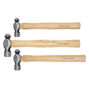 Three Sealey Ball Pein Hammers from the AK203 set with "GENUINE HICKORY" wooden handles and drop-forged steel heads are lined up horizontally, showcasing different sizes. These durable tools come with a lifetime guarantee.