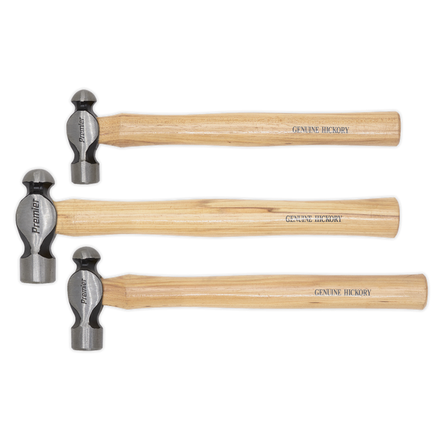 Three Sealey Ball Pein Hammers from the AK203 set with "GENUINE HICKORY" wooden handles and drop-forged steel heads are lined up horizontally, showcasing different sizes. These durable tools come with a lifetime guarantee.