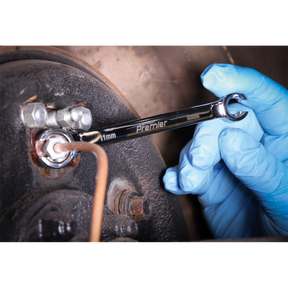 A gloved hand using a Sealey 9mm spanner from the Flare Nut Spanner Set 5pc Metric - AK2651 on a bolt.