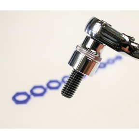 Close-up of a Sealey wrench gripping a screw, with a row of blue hexagonal shapes in the blurred background and the Magnetic Socket Insert Set 10pc Metric - AK27095 retaining fasteners securely.