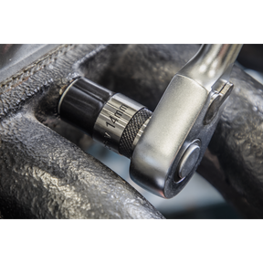 A close-up image of a Sealey Premier Black Series Socket Set 13pc 1/2"Sq Drive Lock-On™ ratchet wrench with a 14 mm socket in use on a mechanical piece, showcasing its corrosion resistance and durable Chrome Vanadium steel construction.