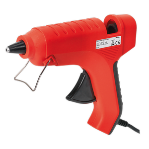 The Sealey Glue Gun 40W 230V - AK292, featuring a red body with a black trigger and nozzle, a metal stand, and a comfortable handle, is connected by a black power cord.