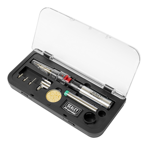 The Sealey Professional Soldering/Heating Kit - AK2962 comes in a sleek black plastic case with a transparent lid. This versatile hand tool set includes a gas soldering iron with piezoelectric ignition, various tips, and essential accessories such as a sponge and metal pieces, providing everything needed for precise and convenient soldering tasks.