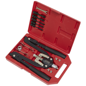 The Sealey Rivet & Threaded Nut Rivet Kit - AK39602 is a red plastic toolbox that includes a rivet gun set with various sized nozzles, a wrench, and other neatly arranged components. It features both a drop-forged frame and threaded rivets for durable and versatile performance.