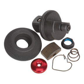 A collection of mechanical parts, including a gear, spring, washers, and a small red circular component from the Sealey Repair Kit for AK5763 1/2"Sq Drive - AK5763.RK, arranged on a plain background.