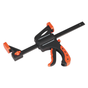The Sealey Ratchet Bar Clamp 150mm - AK6101, featuring a comfort grip handle and a trigger mechanism for adjusting and securing materials, in black and orange, isolated on a white background.