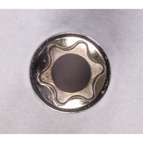 Top view of a six-pointed star-shaped metal object from the Sealey TRX-Star* Socket Set (14pc, 1/4", 3/8" & 1/2"Sq Drive E4-E24 - AK618), made from Chrome Vanadium steel with a hollow center and exceptional corrosion resistance, set against a plain, light-colored background.