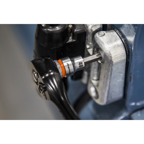 A close-up view of a Sealey TRX-Star* Socket Bit from the 9pc 3/8"Sq Drive Platinum Series - AK6251 being used to tighten a bolt on machinery. The chrome vanadium steel socket head, labeled "10," ensures durability and strength.