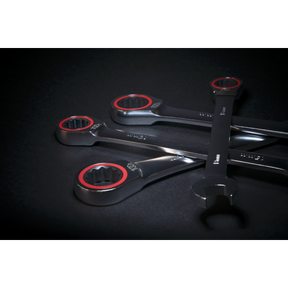 A set of Sealey's Ratchet Combination Spanner Set 12pc Metric Platinum Series - AK63940, featuring Chrome Vanadium steel spanners with circular ends, partially overlapping each other, displayed on a dark background.