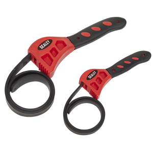 The Sealey Strap Wrench Set 2pc - AK6408 features two red and black strap wrenches of different sizes, equipped with adjustable rubber straps and soft grip handles, ideal for removing oil filters with capacities ranging from Ø120 to Ø150mm.