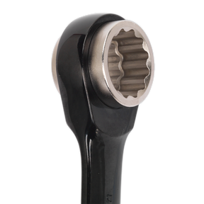 Close-up image of the Sealey Ratchet Ring Spanner 4-in-1 Reversible Metric - AK7979, made from Chrome Vanadium steel with a silver, round socket at the end.