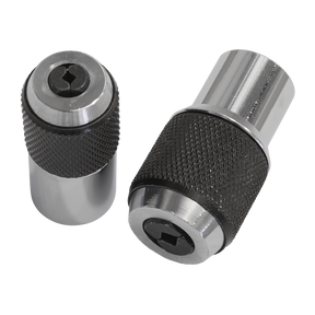 Two cylindrical metallic chucks with knurled grips, one standing upright and the other lying on its side, designed for accurate tapping in tight spaces. They are part of the Sealey Adjustable Tap Socket Set 2pc - AK872.