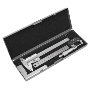 The Measuring Tool Set 4pc - AK91SET by Sealey includes a metallic caliper, micrometer, and stainless steel rule, all placed inside an open black foam-lined gray case.