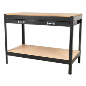 The Sealey Workbench with Drawer 1.2m - AP12160 features a sturdy black metal frame and an MDF worktop, complemented by a large drawer with two silver handles and a lower wooden shelf for additional storage space.