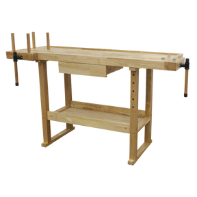The Sealey Woodworking Bench - AP1520 is a sturdy oak workbench equipped with vices on both ends, an under-shelf, and multiple holes for adjustable pegs.